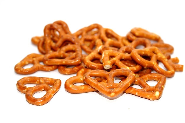 Photo baked heart shaped pretzels brown detail isolated