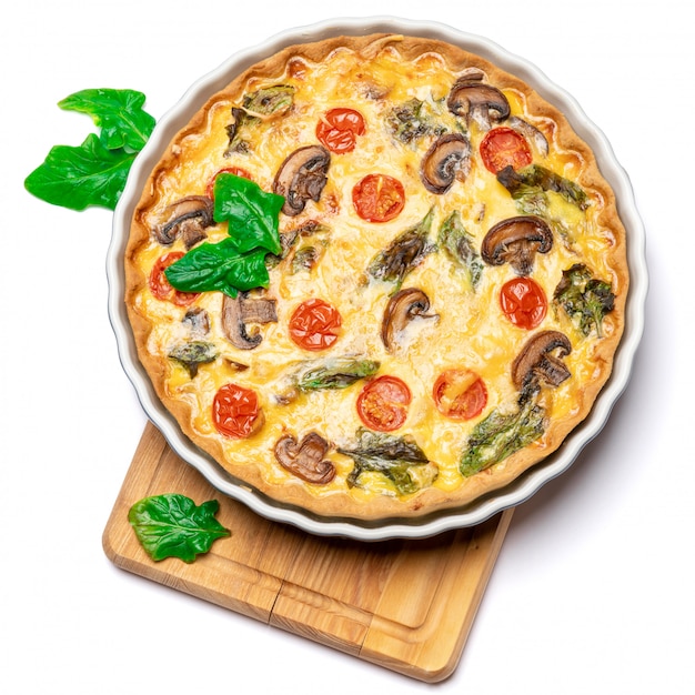 Baked homemade quiche pie in ceramic baking form