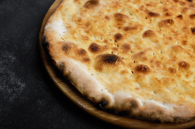 Baked jewish matzo bread on wooden board