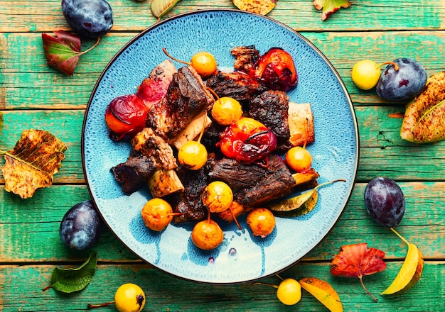 Baked lamb ribs with fruit sauce