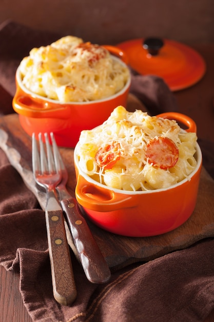 Baked macaroni with cheese in orange casserole