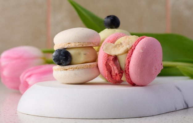 Baked macarons with different flavors on the table dessert