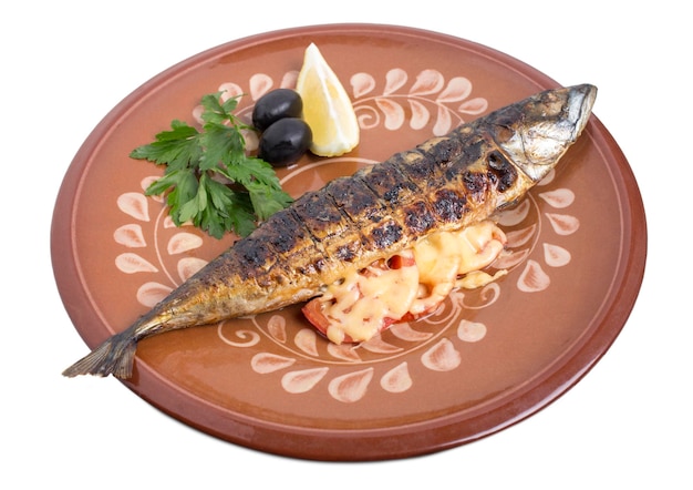 Baked mackerel on a clay plate