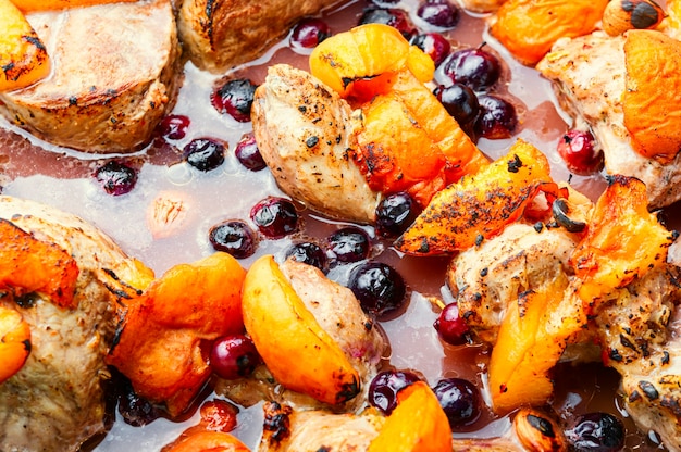 Baked meat in red wine with apricot and blackcurrant.Stewed pork.