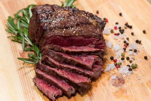 Baked meat and vegetables on a wooden board