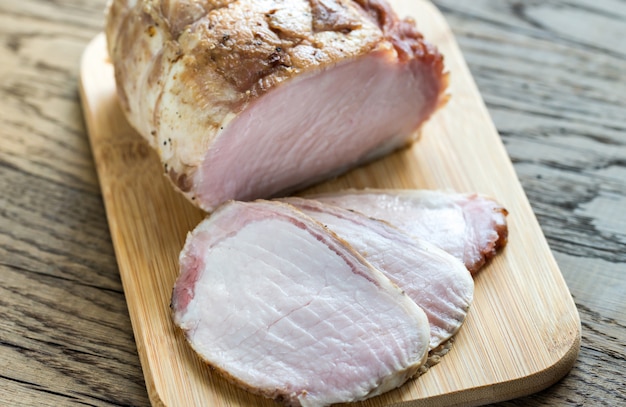 Baked meat on wooden board