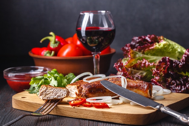 Baked meat on wooden cutting board