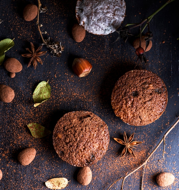 Baked muffins on a black table