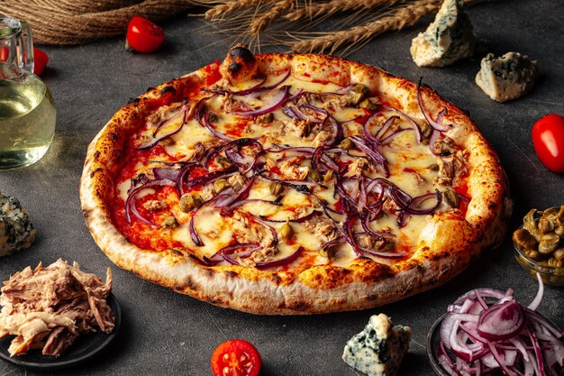 Baked onion pizza on the decorated surface