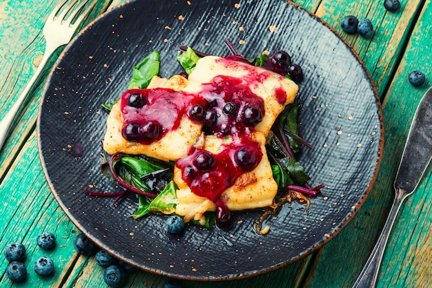 Baked pangasius fish with blueberries