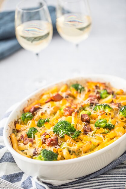 Baked pasta penne with broccoli smoked pork neck mozzarela\
cheese and othe ingredients.
