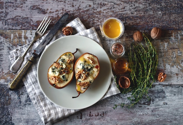 Baked pears with blue cheese on a plate