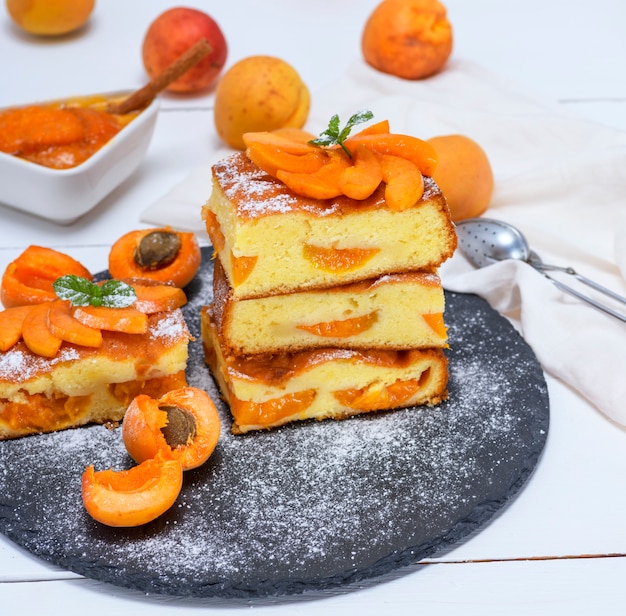 Baked pieces of biscuit pie with apricots