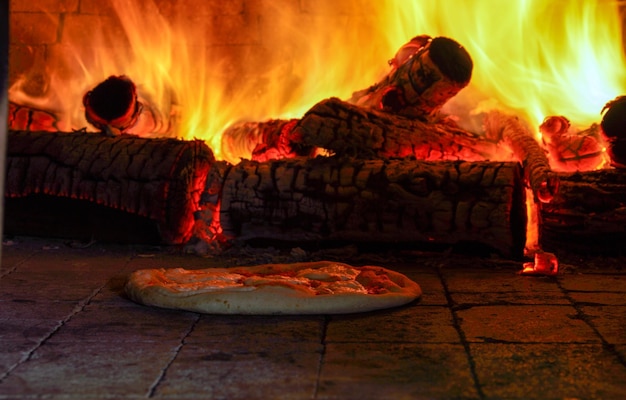 Baked pizza in the wood oven