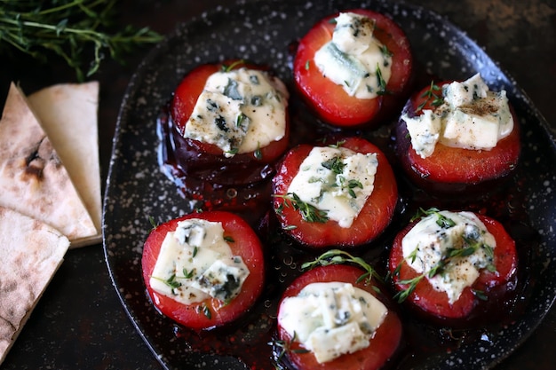 Baked plums with blue cheese and thyme Autumn snack