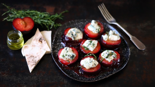 Baked plums with blue cheese and thyme Autumn snack