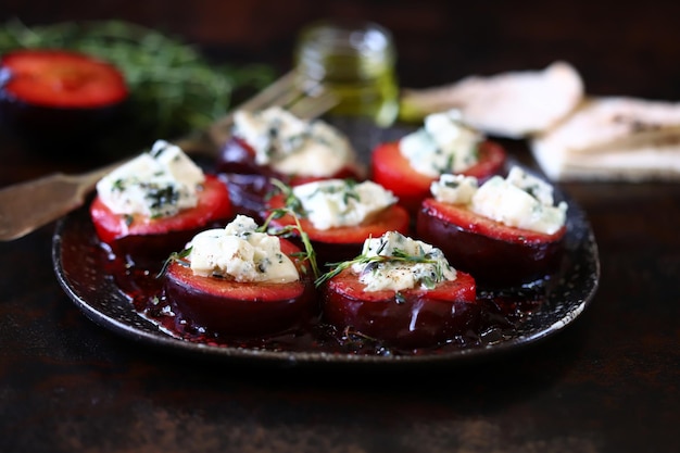 Baked plums with blue cheese and thyme Autumn snack