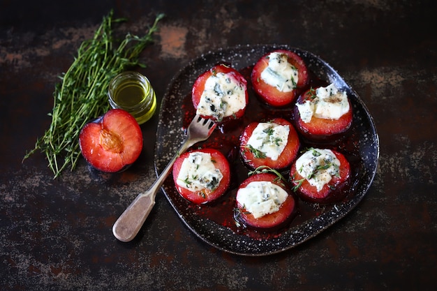 Baked plums with blue cheese and thyme