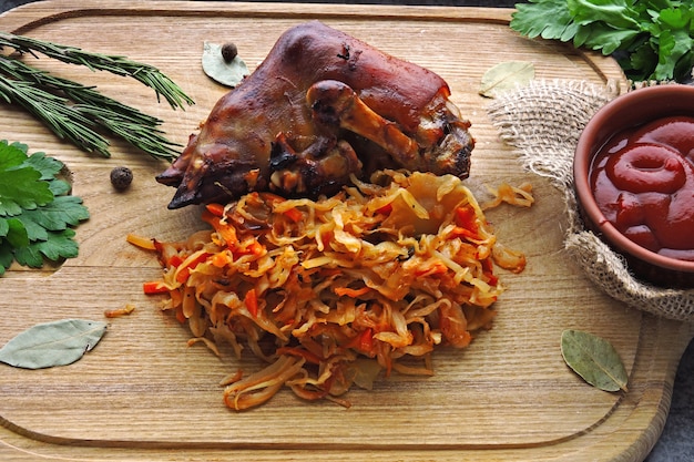 Baked pork leg with sauerkraut. German or Polish national dish.