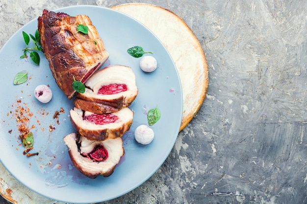 Baked pork meat with cherry