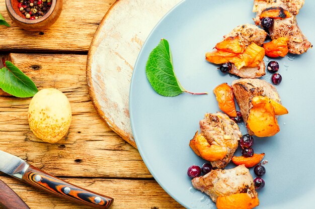 Baked pork in red wine with apricot and blackcurrant.