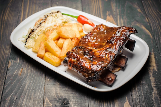 Baked pork ribs glazed in soy sauce and honey, close-up