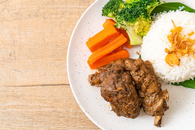 Baked pork ribs with sauce and rice