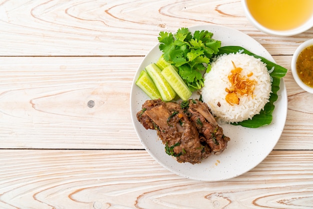 Baked pork ribs with sauce and rice