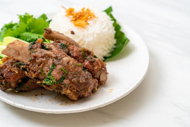 Baked pork ribs with sauce and rice