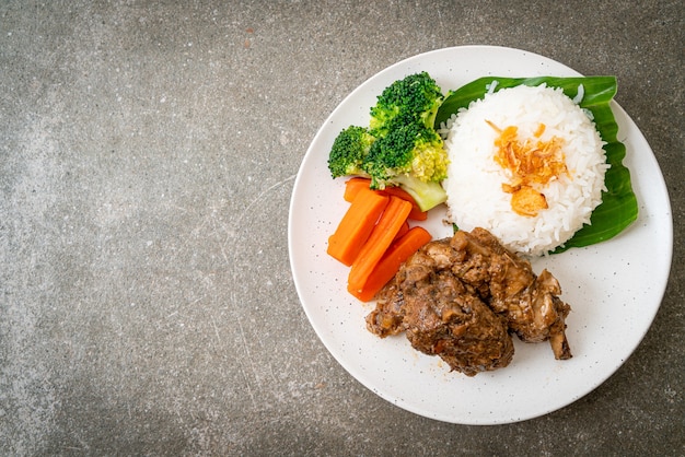 Baked pork ribs with sauce and rice