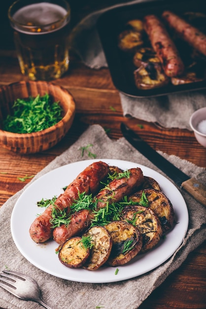 Baked Pork Sausages with Slices of Eggplant