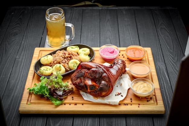 Baked pork shank with sauerkraut with bigus