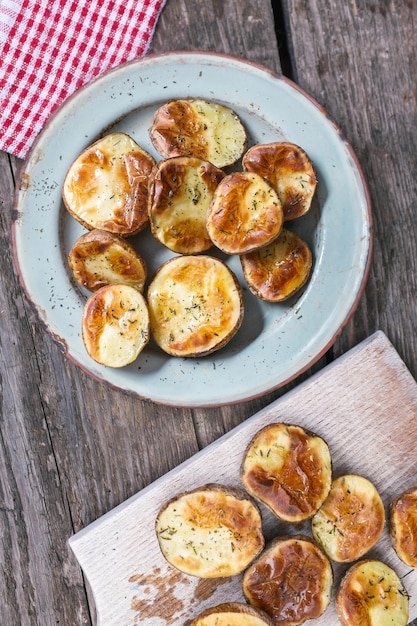 Baked potato halves with herbs