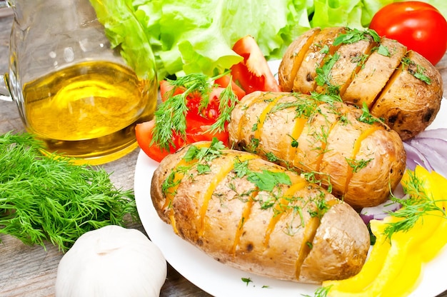 baked potato on a plate with vegetables