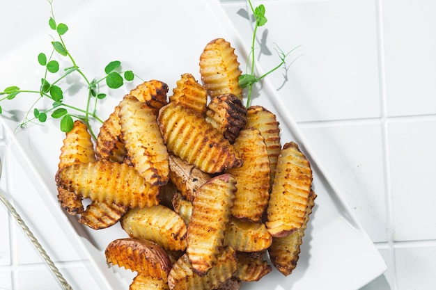 Baked potato slices on a light background