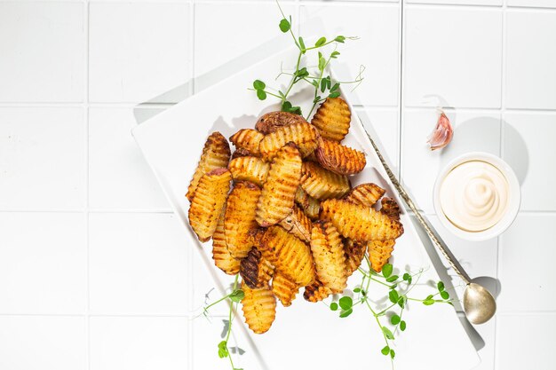 Baked potato slices on a light background