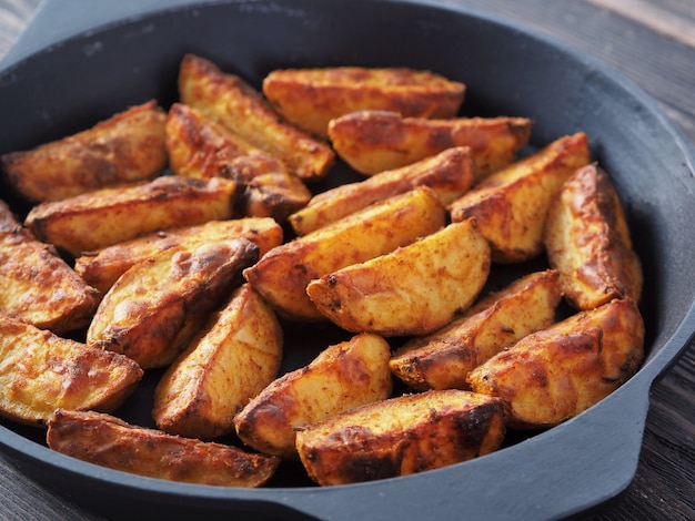 Baked potato wedges in a cast iron pan