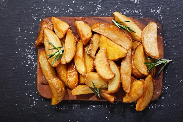 Baked potato with rosemary top view