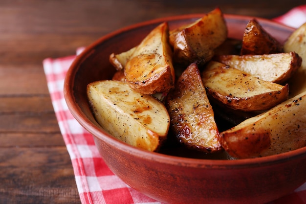 baked potatoes in bowl on table close up