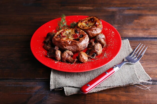 baked potatoes with mushrooms on pate on wooden table
