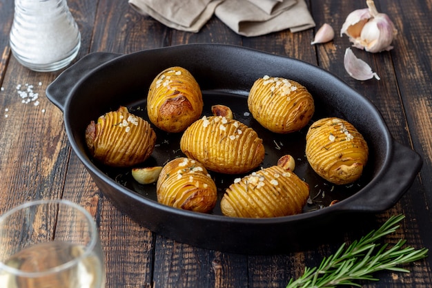 Baked potatoes with rosemary and garlic. Healthy eating. Vegetarian food.