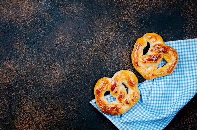 Baked pretzels on a dark table