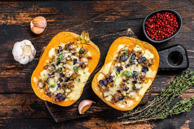 Baked pumpkin stuffed with ground meat, vegetables and herbs