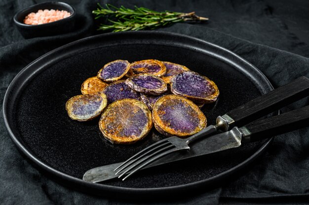 Baked purple potatoes with rosemary. 