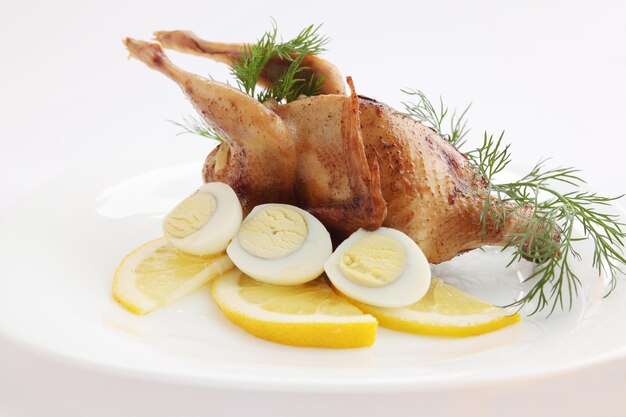 Baked quail with the lemon and the eggs