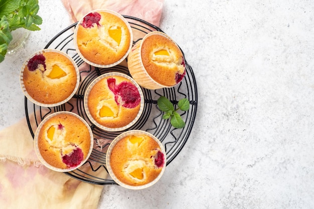 Baked raspberry peach muffins