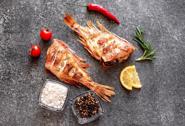 baked red sea bass on a stone background