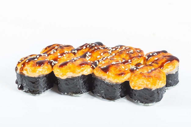 Photo baked roll, sushi, with teriyaki sauce, home-style, rustic, handmade, on an isolated white
