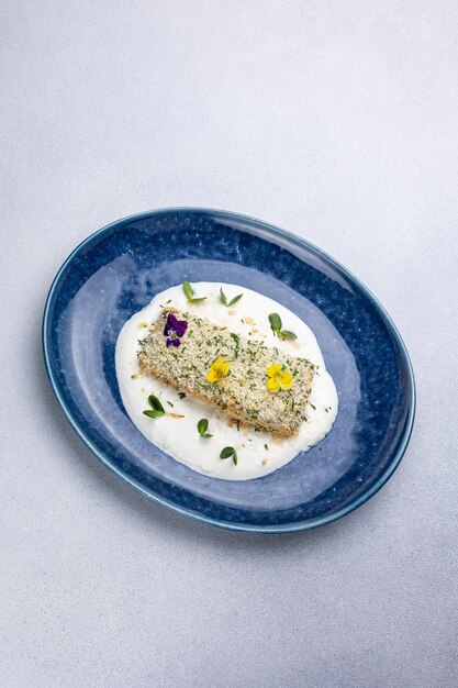 Baked salmon fillet on a blue plate