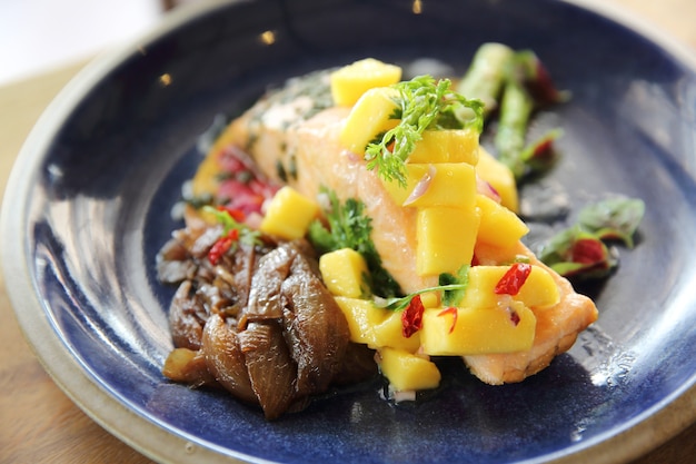 Baked salmon fillet with rosemary, lemon and mango